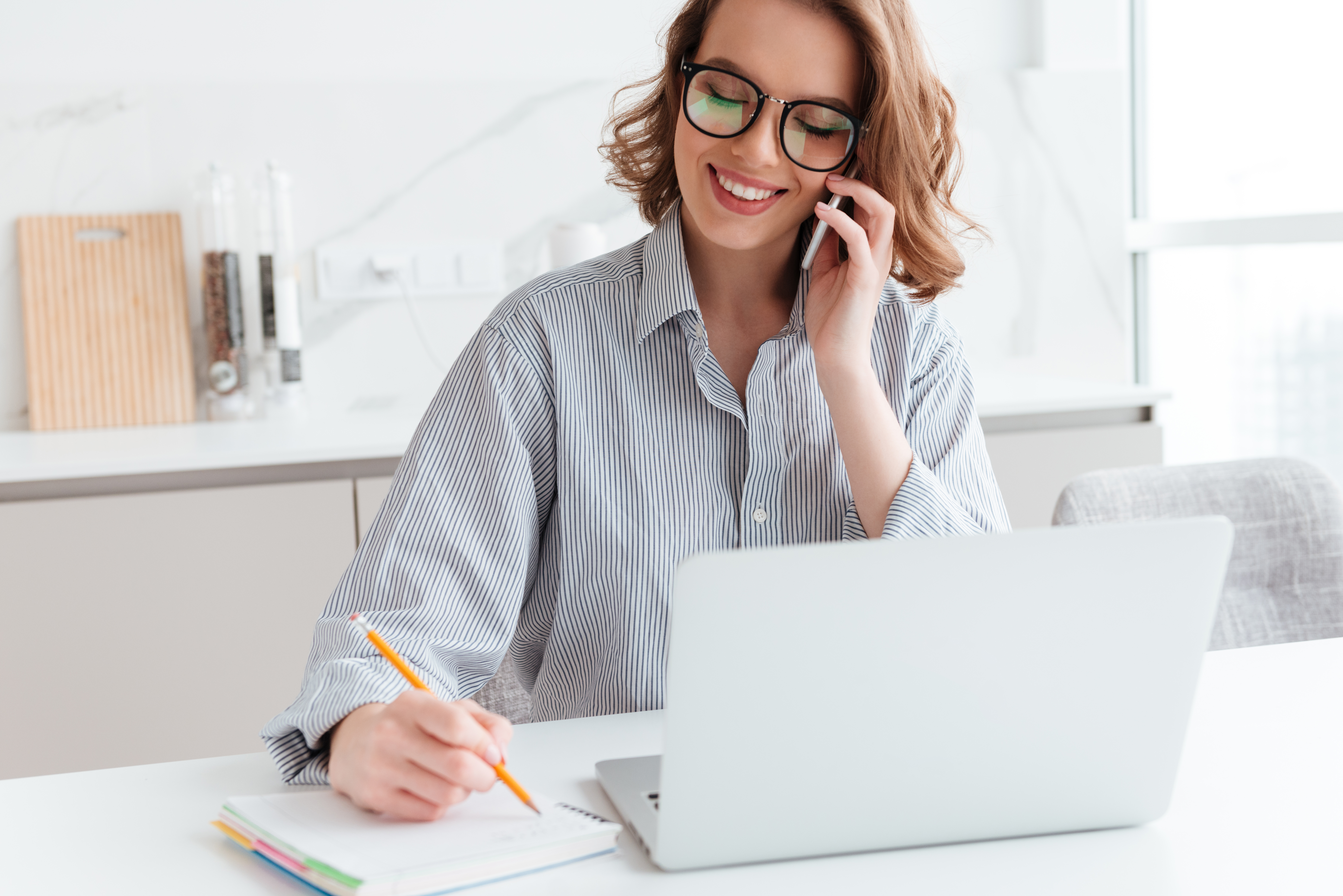 Smiling professional AI secretary Gena taking notes and holding a phone